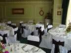 White Chair Covers and Chocolate Taffeta Sash